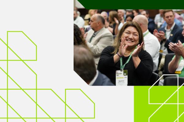 member clapping at conference