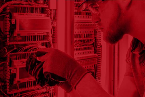 Image of employee installing network sensors.