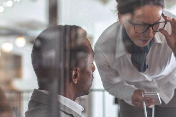 business people looking at a tablet
