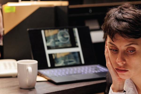 Financial investigators reviewing the aftermath of a cyberattack.