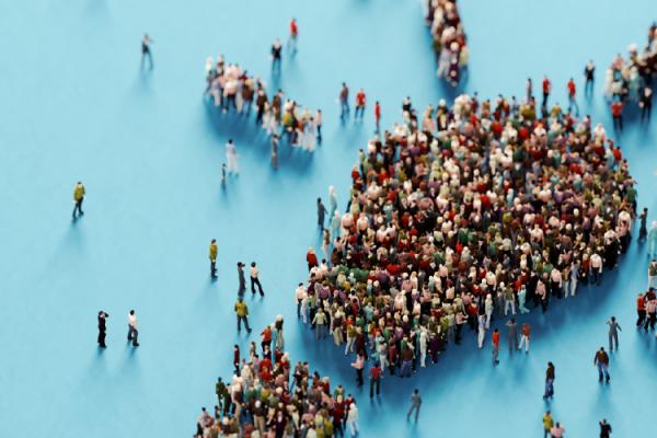 People gathered in the shape of a light bulb