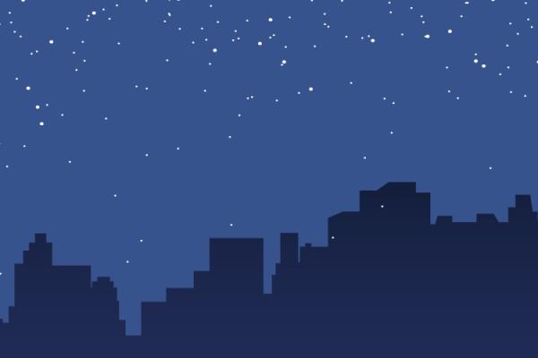 a dark outline of a city under a starry sky