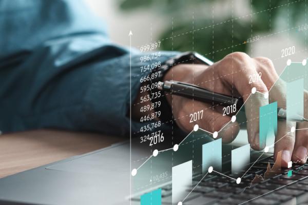 Accountant using data analytics for cost forecasting