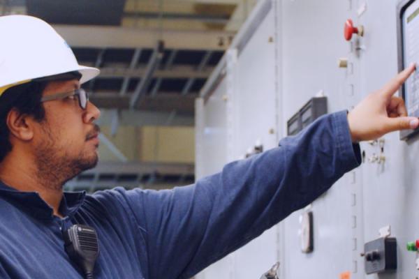 Worker at Orlando Utilities Commission performing a facility inspection