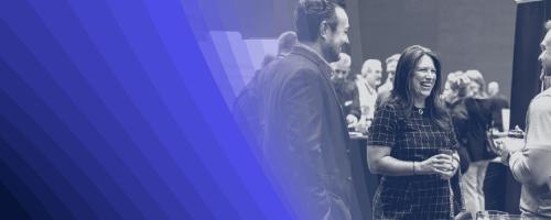 Black-and-white image of a group of people talking with a blue-hued overlay