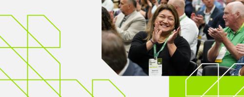 member clapping at conference