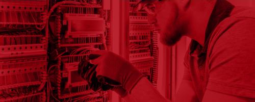 Image of employee installing network sensors.