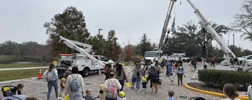 Community event with bucket trucks