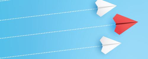 three paper airplanes with dotted line trails