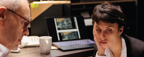 Financial investigators reviewing the aftermath of a cyberattack.