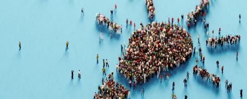 People gathered in the shape of a light bulb