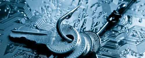 set of keys on a fish hook over a computer mother board background