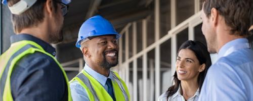 people in hard hats talking
