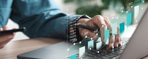 Accountant using data analytics for cost forecasting