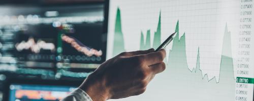 person pointing at a chart