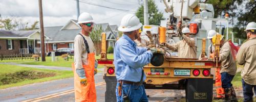 Crew with Greenville Utilities unloading a truck of supplies