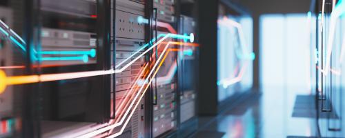 A bank of servers with colorful lines of light on top